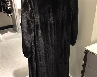Neiman Marcus FERAUD Paris
Full-length Long Ladies Black Mink Fur Coat
Made in Canada
Estimated retail: $29,000
Extremely high quality. Excellent condition. Excellent, clean lining. Dual slit pockets at sides. Concealed 3 hook-and-eye closures in front. Front-top button for extra warmth. Worn twice. Magnificent sheen on this fur.
This coat has NOT been altered in size from its original purchase.
4 monogrammed initials in inside lining.
Comes with Neiman Marcus dust bag.
APPROXIMATE MEASUREMENTS:
Length from top of shoulder to bottom of coat: 52"
Shoulders: 18"
Sleeve: 26"
Waist: 40"