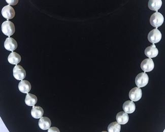 BAROQUE PEARL NECKLACE
Beautiful Baroque White Pearls with fabulous luster. 
19" from end to end, including clasp. 
 