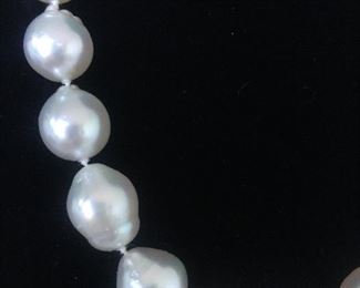 BAROQUE PEARL NECKLACE
Beautiful Baroque White Pearls with fabulous luster. 
19" from end to end, including clasp. 