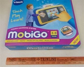 Vtech Mobigo touch learning system in box, used. untested, Toy Story 3 learning game unopened