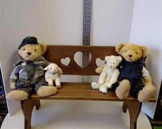 Wood bench with stuffed bears and lamb