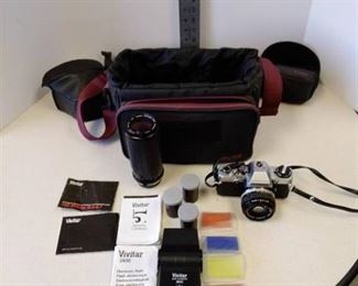 Olympus 35 mm camera, Vivitar 2800 Flash, Macro focusing zoom lense, and case