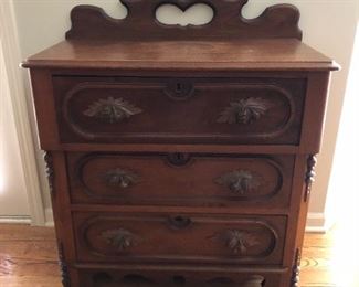 antique walnut wash stand with stylized pulls and pull out towel bar on side