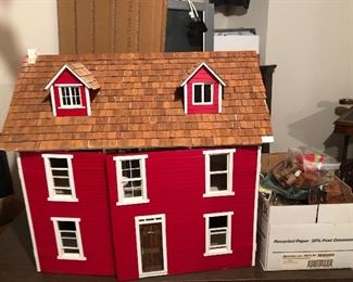 vintage dollhouse filled with furniture