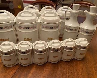 full set of German canisters includes 6 large, 6 small spice, 2 cruets. All in excellent condition except one repaired lid on one spice