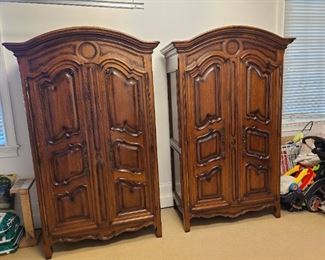 Lot 001 $6,950.00 Baker Furniture two matching Armoires. Milling Road Collection, French Rococo design, heavy molded panels with a beveled apron. Perfect addition to Farmhouse decorating. Rare to have two matching Armoires. Perfect for planning design element to your home. Circle molded design at top gives a modern flare to this traditional piece. Walnut wood.
Six surfaces, five are shelves, four adjustable shelves and one fixed shelf is at 37.5 inches from the floor. Three in one options for storage. TV, hang ...
Image of Baker Furniture French Milling Road Armoires - a Pair
DIMENSIONS
55ʺW × 28ʺD × 90ʺH
CONDITION
Vintage / Antique / Used, Original Condition Unaltered, Some Imperfections
Normal wear and tear for the age of the Armoires. Good condition. Minor rubbed hardware on door hinges. Wood splints on upper side of Armoires.
