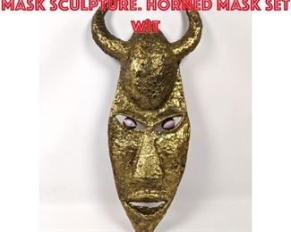 Lot 39 Welded and Hammered Mask Sculpture. Horned mask set wit