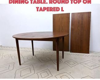 Lot 388 Danish Modern Teak Dining Table. Round top on tapered l