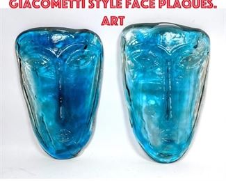 Lot 437 Pr Light Blue Glass Giacometti style face plaques. Art 