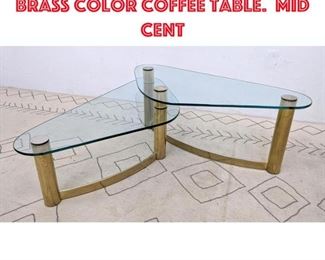 Lot 526 Two level Modernist Brass color coffee table. Mid Cent