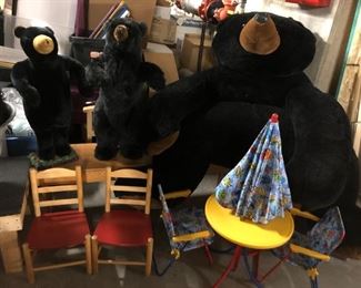 More large stuffed bears; pair of chairs for children; child-sized set of patio furniture.