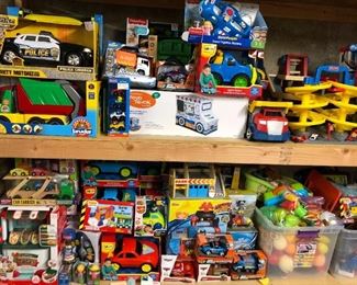 Huge selection of toys, many NIB, including this great selection of toy cars and trucks.