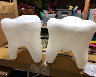 Two teeth, or not two teeth?  Pair of large pop art plastic tooth stools.