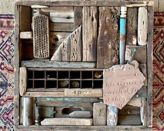 Item 69:  Eclectic "reclaimed" wall art - 22"l x 3"w x 21"h:  $275                                                                                        This item is super cool, made from bits and pieces of who knows what. There is a little piece of wood in the middle marked 1872 and a pottery shard with writing