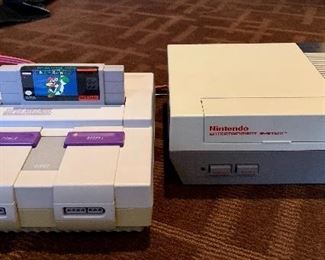 Item 211:  Nintendo Entertainment Systems with games and accessories: $80 for system on left and 