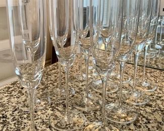 Item 55:  (13) Signed Champagne Glasses - large set: $125