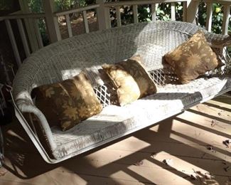 Wicker porch swing
