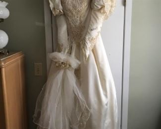 Very beautiful wedding dress ca. 1980..  However, so beautifully beaded, would be a beautiful dress now.  Could be tailored to your desires.