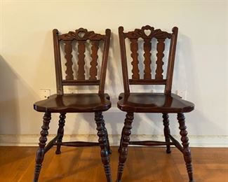Pair of carved wooden chairs
