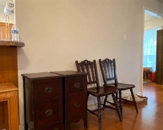Antique end tables, pair of carved wooden chairs. 