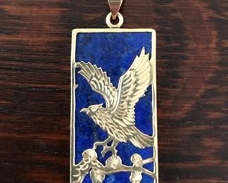 Large 14k yellow gold hawk on lapis lazuli stone pendant.  It is 1 3/8" tall by 5/8" wide, and weighs 3.6g.  $288