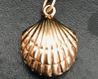 14k yellow gold petite 3D shell pendant or charm, measuring 3/4" tall (including bale) by 1//2" wide.  Weight is 0.8g.  Marked 585 for 14k.  $88