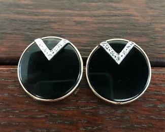 14k yellow gold post earrings, black onyx, with tiny diamond accents, measuring 7/8" in diameter, weighing 5.7g.  $188