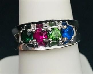 10k white gold ring  with emerald, ruby, peridot, and sapphire lab created gemstones.  It is size 8, weighing 3.8g.  $280
