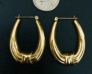 14k yellow gold earrings, measuring 1 1/2" tall by 1" wide, and weighing 3.5g.  $388