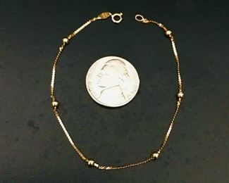 14k yellow gold dainty bracelet with 6 bead stations. 
It is 7" long, and weighs 0.9g.  $98                                                               