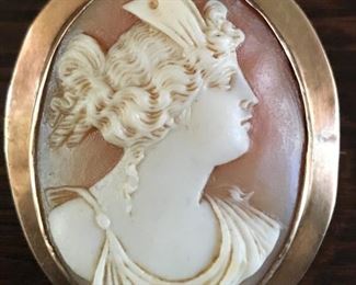 14k yellow gold frame surrounds a large vintage carved shell cameo measuring 1 3/4" by 1 7/8".  It weighs 9.5g.  $420