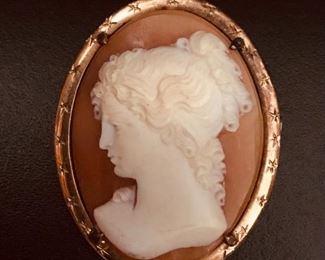 18k yellow gold antique carved shell cameo pin or pendant, measuring 1 1/2" tall by 1 1/8" wide, and weighing 6.0g.  $428