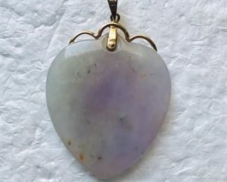 14k gold and jade heart pendant, measuring 1 1/2" tall, by 1" wide. $148