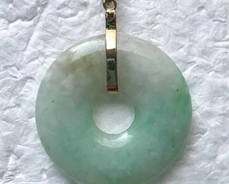 14k yellow gold and jade vintage pendant, measuring 1 1/4" tall (including bale) by 7/8" wide.  $128