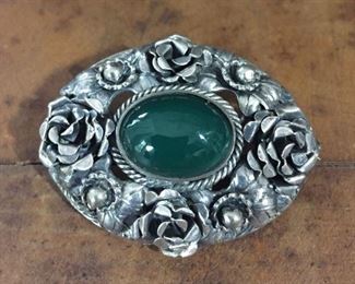 Vintage Peruzzi sterling silver brooch with green cabochon. Size 1 1/2" w x 1 1/8" h.  Signed PERUZZI, stamped STERLING. $200