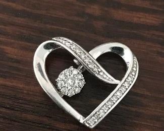 Diamond heartbeat trembler pendant set in sterling silver, size 11/16" w x 5/8" h. $140