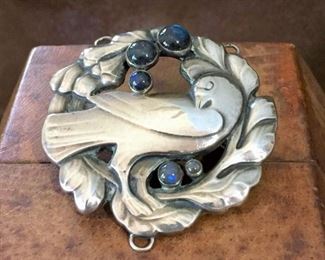 Old Georg Jensen #70 large 830 silver dove brooch with blue moonstone cabochons. Size 2 3/8" diameter. Very unique feature of three loops (2 on top, one bottom center) on this piece which means it was made to also be a pendant. Marks: IMPORTE DE DANEMARK GI 70 and 830 inside a dotted circle and a small oval stamp with a J inside. Picture of back next...$1800