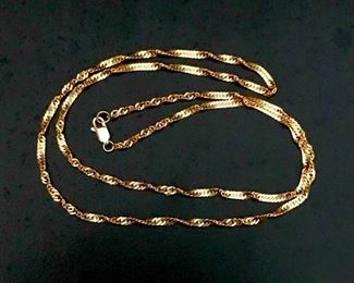22" 14k yellow gold twisted link chain, weighing 7.1g.  $520