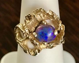14k yellow gold and stunning intense blue and purple opal ring.  3/4" tall, size 7, weighs 7.1 grams.  One of a kind artisan piece.  $880
