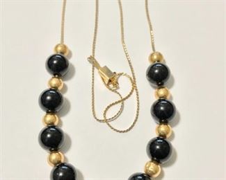 14k yellow gold and black onyx add-a-bead 16" necklace.  Onyx beads are 7mm and total weight is 7.1g.  $290