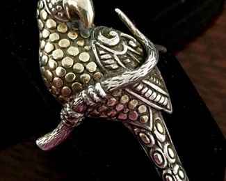 Large vintage signed sterling silver parrot brooch with faceted gemstone eye. Size 1 5/8" wide x 2 5/8" high. Signed TH with pictogram mark, stamped 925.   $220
