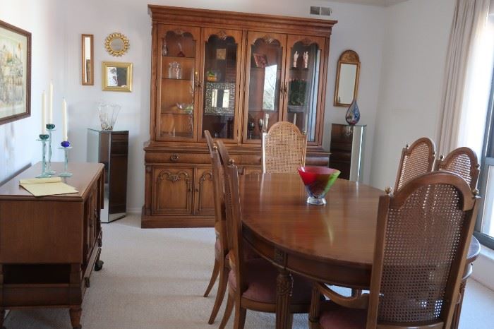    16.      dining  room set with china cabinet, server, table and six chairs. The table has pads and three leaves.  Table is 45 x 66 width w/o leaves..  The  leaves   are  12"  each. China cabinet is 6'11  in height and 75"  wide. Server  is 3'6" wide with two flip over sides of 13"each  it  is  18" deep   The  pieces  can  be  purchased  individually.     Total  cost  is   595.00