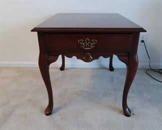 cherry color  rectangular  table   22"  x  27"   table  is  50.00