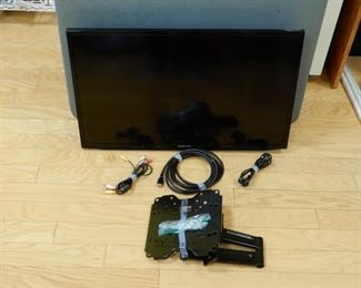 Samsung 32" Wall Mount Smart TV. Included in the package is complete mounting bracket, needed HDMI, Audio Visual, Ethernet and Coax Cords.