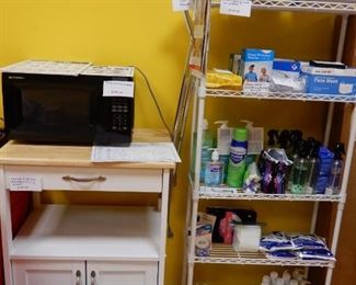 White 5 Shelf unit. Currently filled with PPE Masks, Gloves, Sanitizer, and more; All Items are for sale.