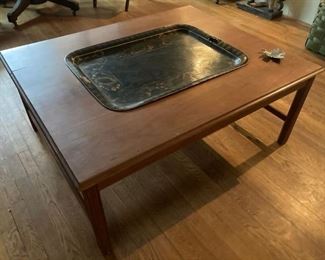 Large table with inverted antique tole tray