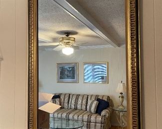 29. Nice black and gold gilded mirror with 2 large candlestick brass sconces  And Fireplace tools $150