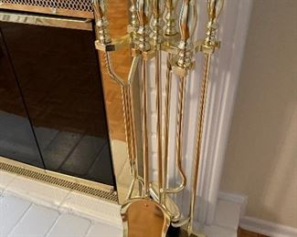 29. Nice black and gold gilded mirror with 2 large candlestick brass sconces  And Fireplace tools $150