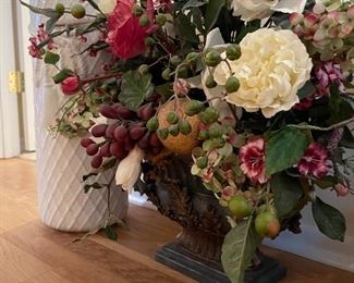 30. Umbrella stand and floral arrangement with 2 small faux floral pieces. $40