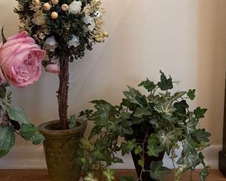 30. Umbrella stand and floral arrangement with 2 small faux floral pieces. $40